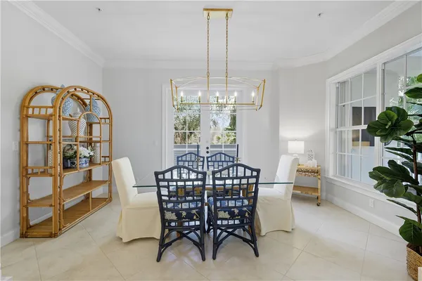 a view of a dining room with furniture window and outside view