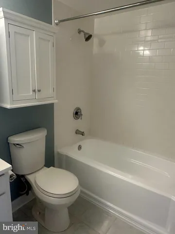a bathroom with a toilet a sink and shower