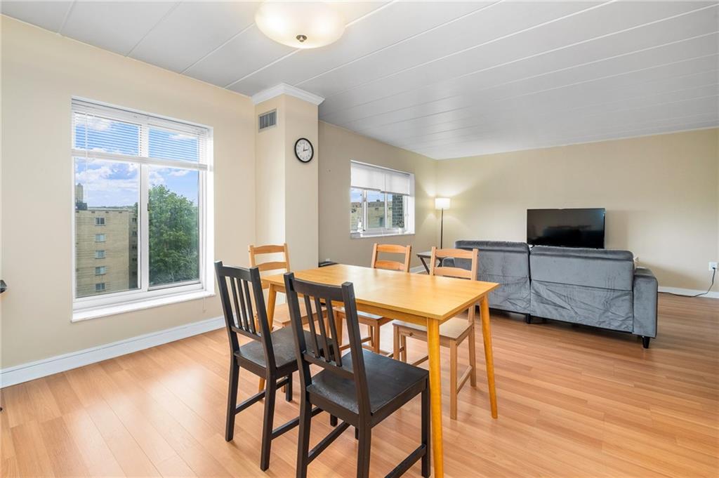 5 Bayard Road, Unit 808 Pittsburgh, PA 15213 - Photo 13 of 33 a dining room with furniture and wooden floor