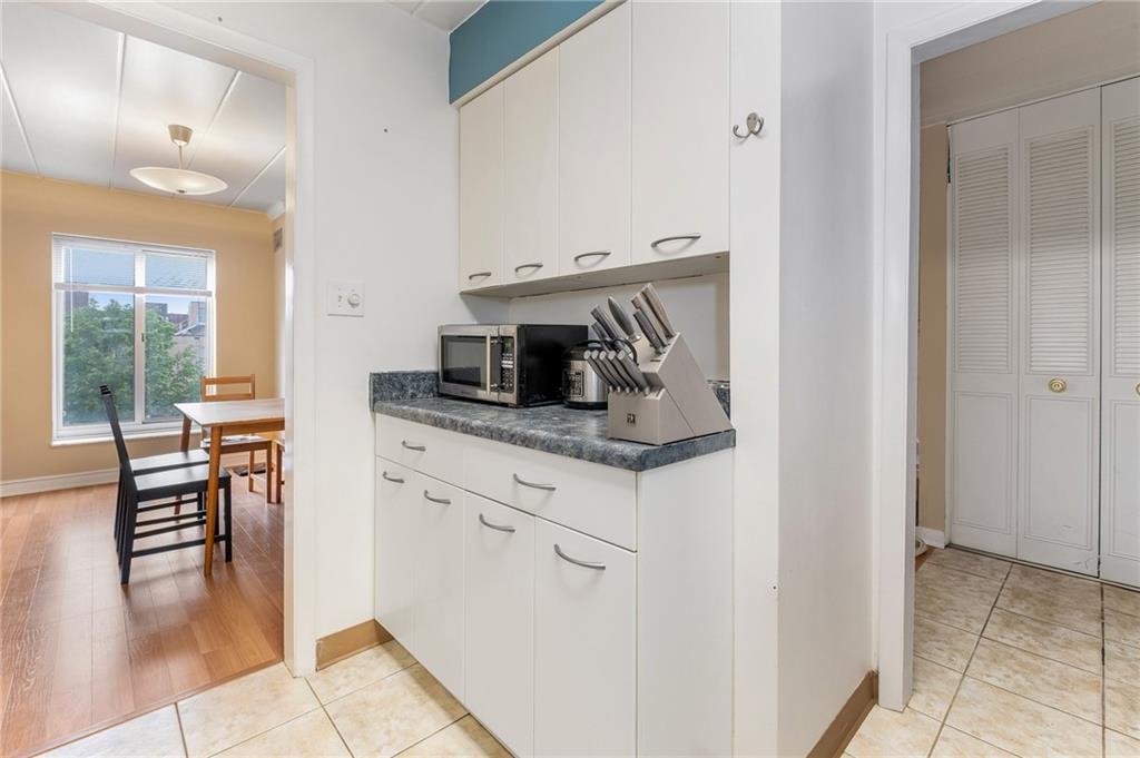 5 Bayard Road, Unit 808 Pittsburgh, PA 15213 - Photo 14 of 33 a kitchen with stainless steel appliances granite countertop a stove and a refrigerator