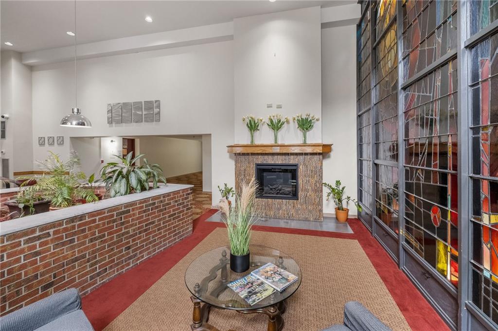 5 Bayard Road, Unit 808 Pittsburgh, PA 15213 - Photo 18 of 33 a living room with furniture and a fireplace