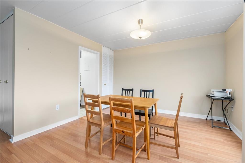 5 Bayard Road, Unit 808 Pittsburgh, PA 15213 - Photo 9 of 33 a view of a dining room with furniture and wooden floor