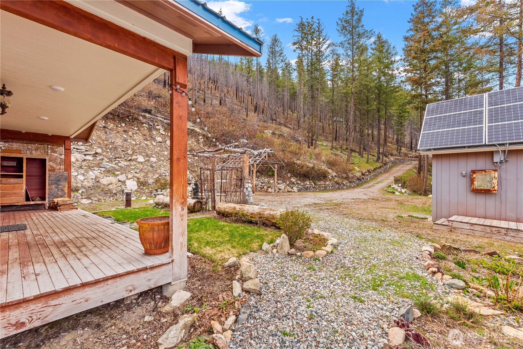 109 Granite Falls Road Chelan, WA 98816 - Photo 17 of 22 a view of a backyard with tree