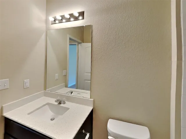a bathroom with a bath tub with a shower