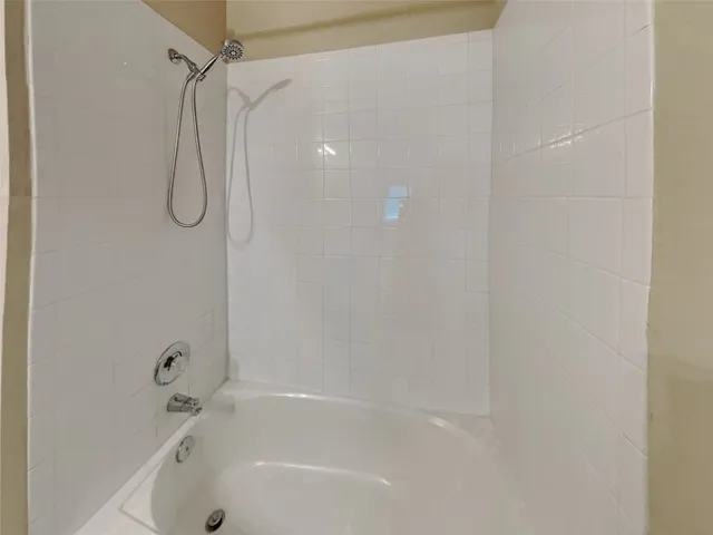 a close up of a bathtub curtain