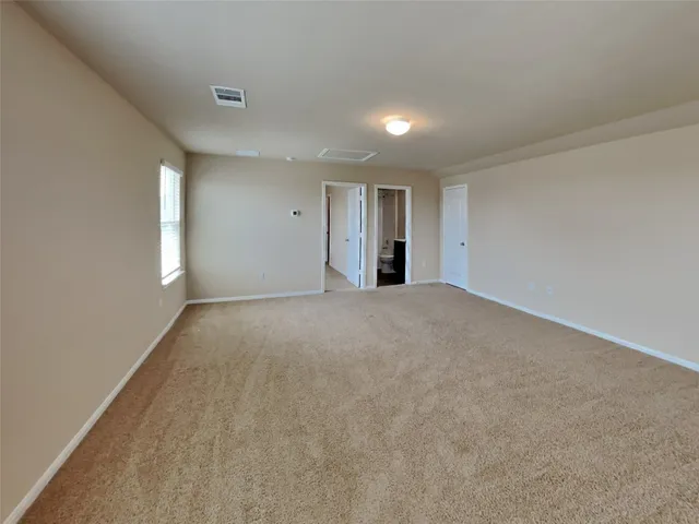 a backyard of a house with yard fire pit and outdoor seating