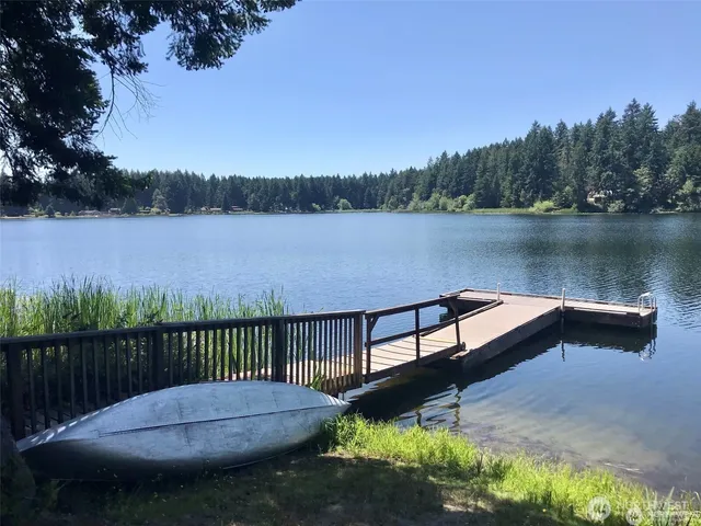 a view of lake with a house in the background