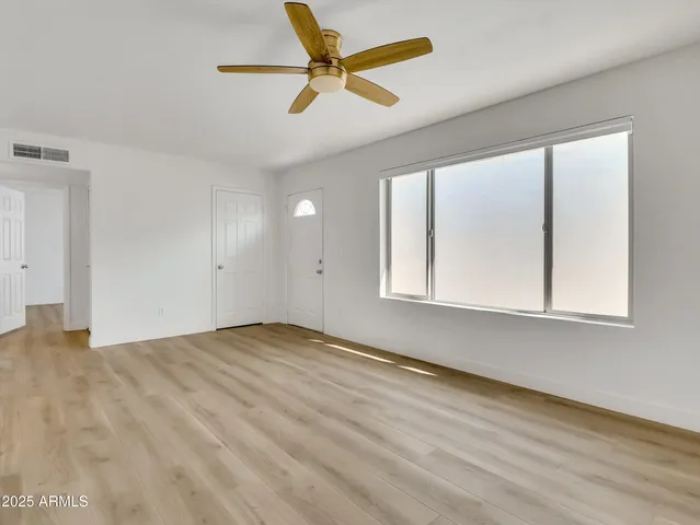 a view of kitchen with wooden floor and electronic appliances
