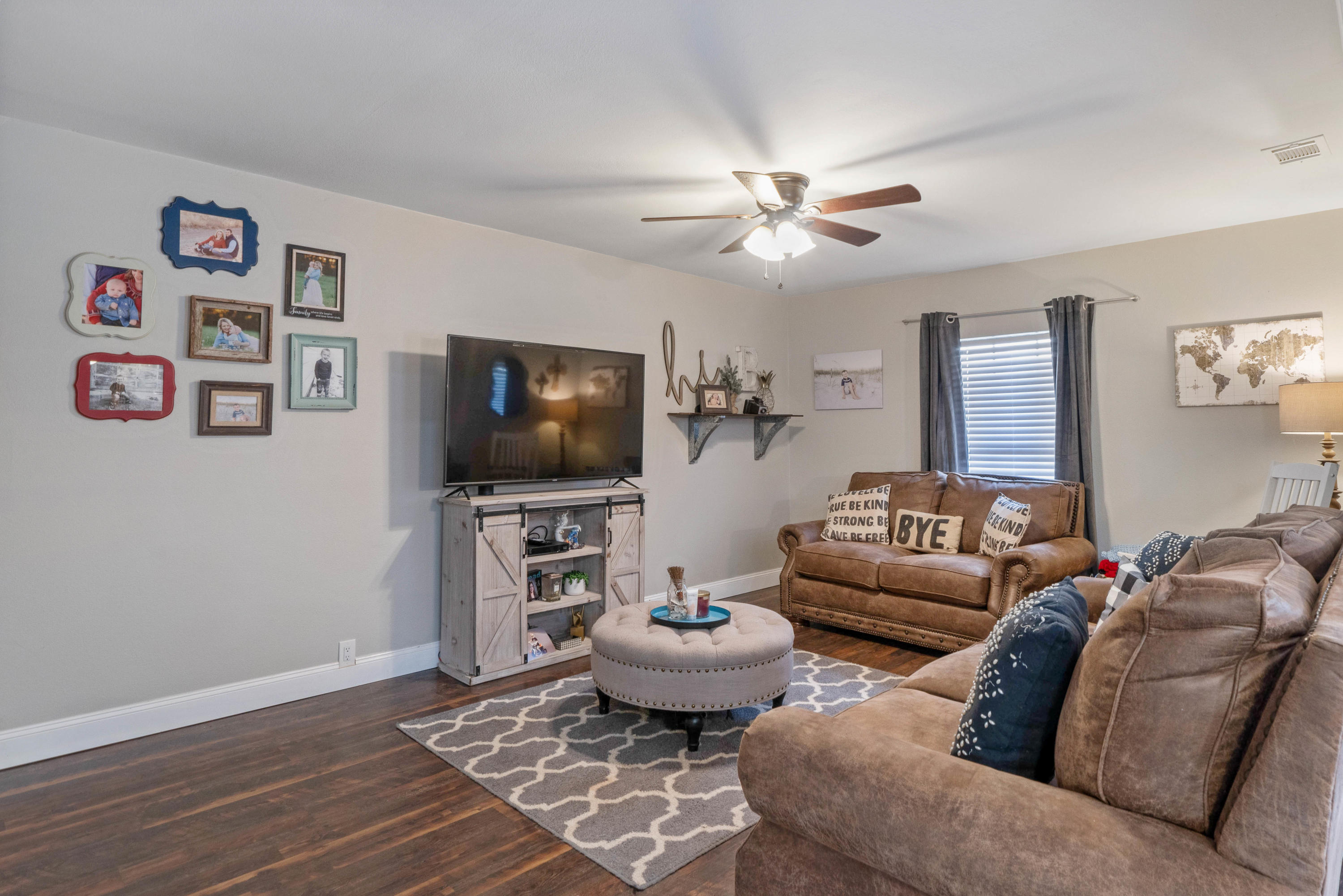 6086 Robin Road Crestview, FL 32539 - Photo 12 of 30 a living room with furniture and a flat screen tv