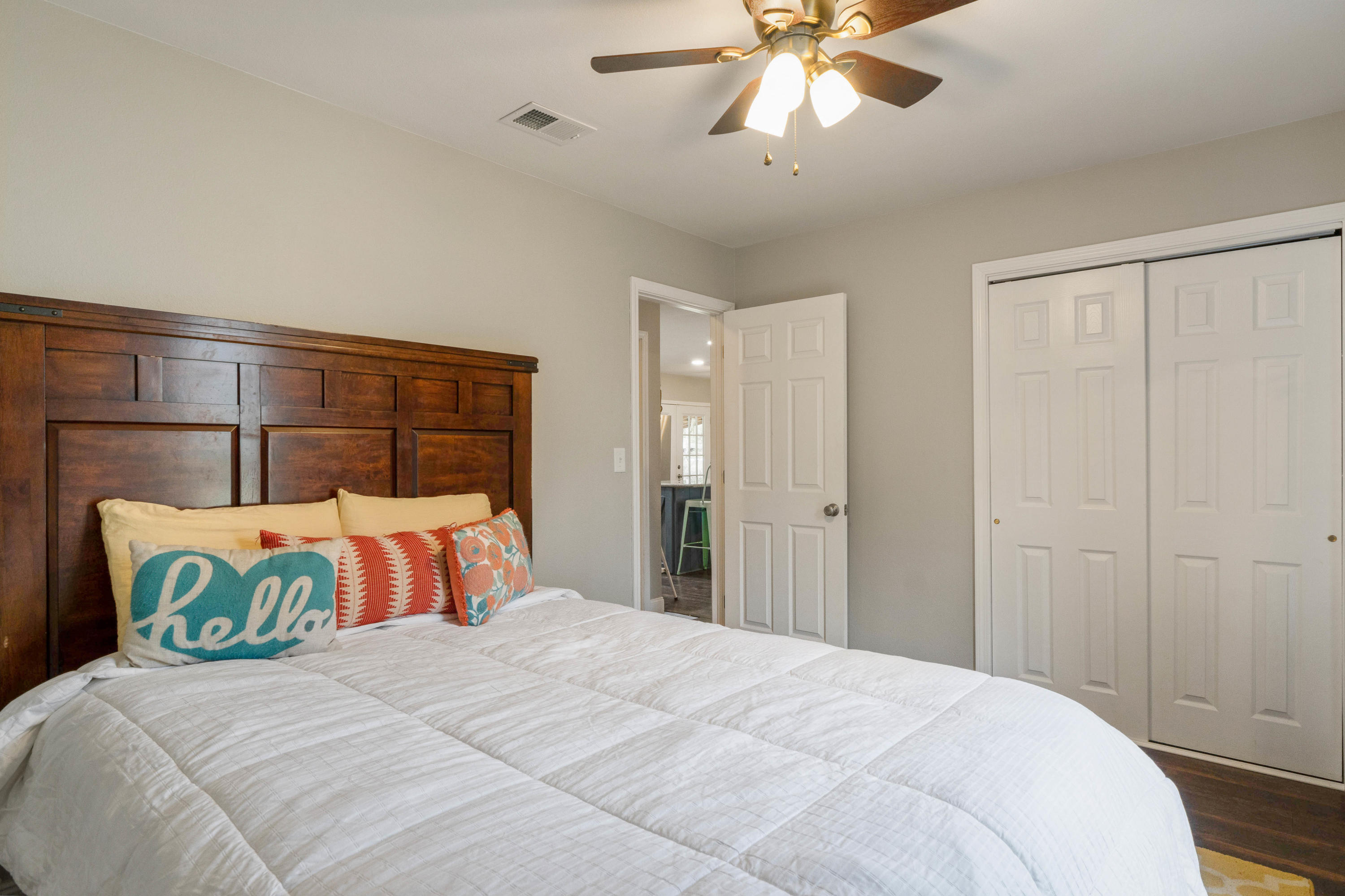 6086 Robin Road Crestview, FL 32539 - Photo 17 of 30 a bedroom with a bed and a chandelier