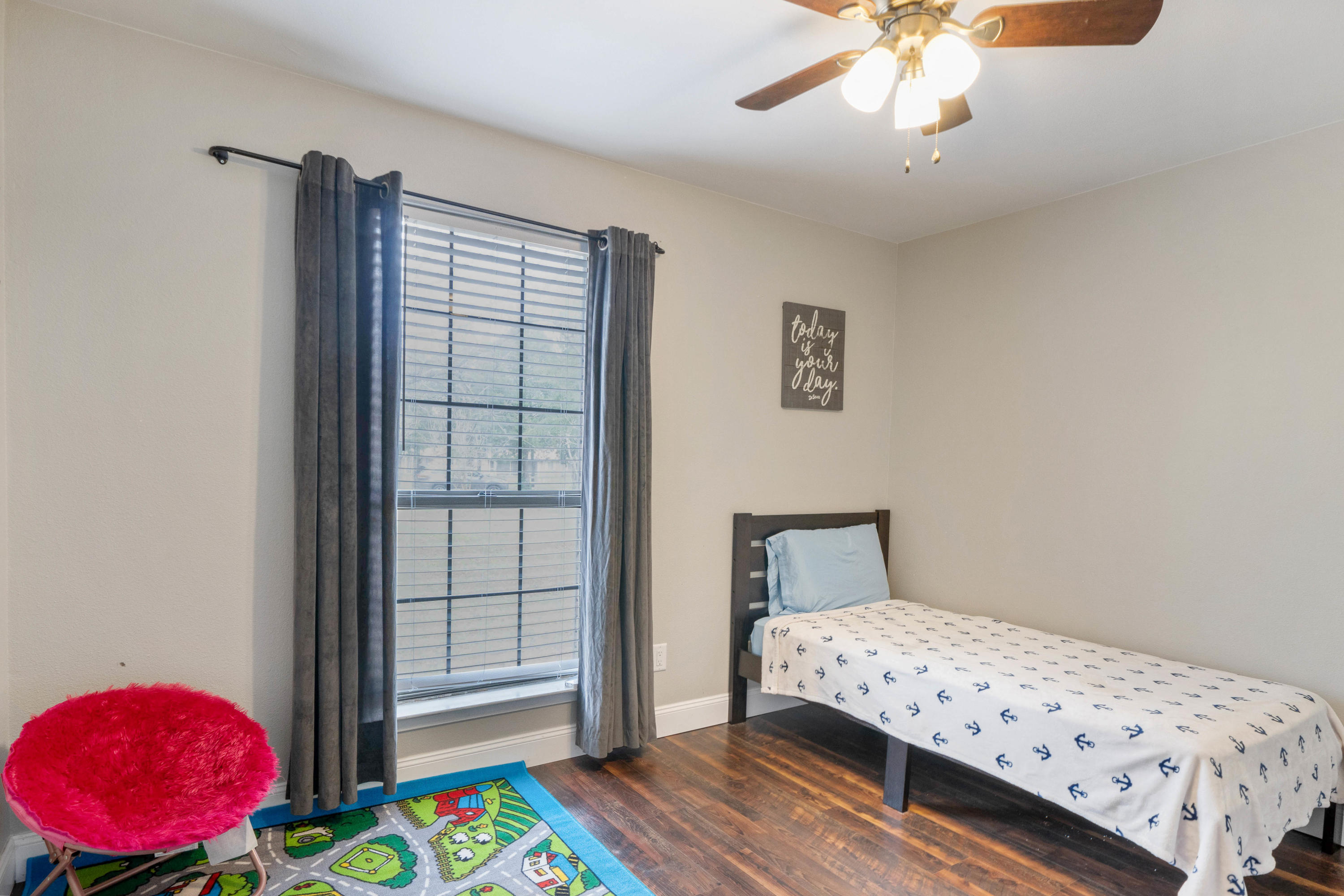 6086 Robin Road Crestview, FL 32539 - Photo 18 of 30 a bedroom with a bed and a window