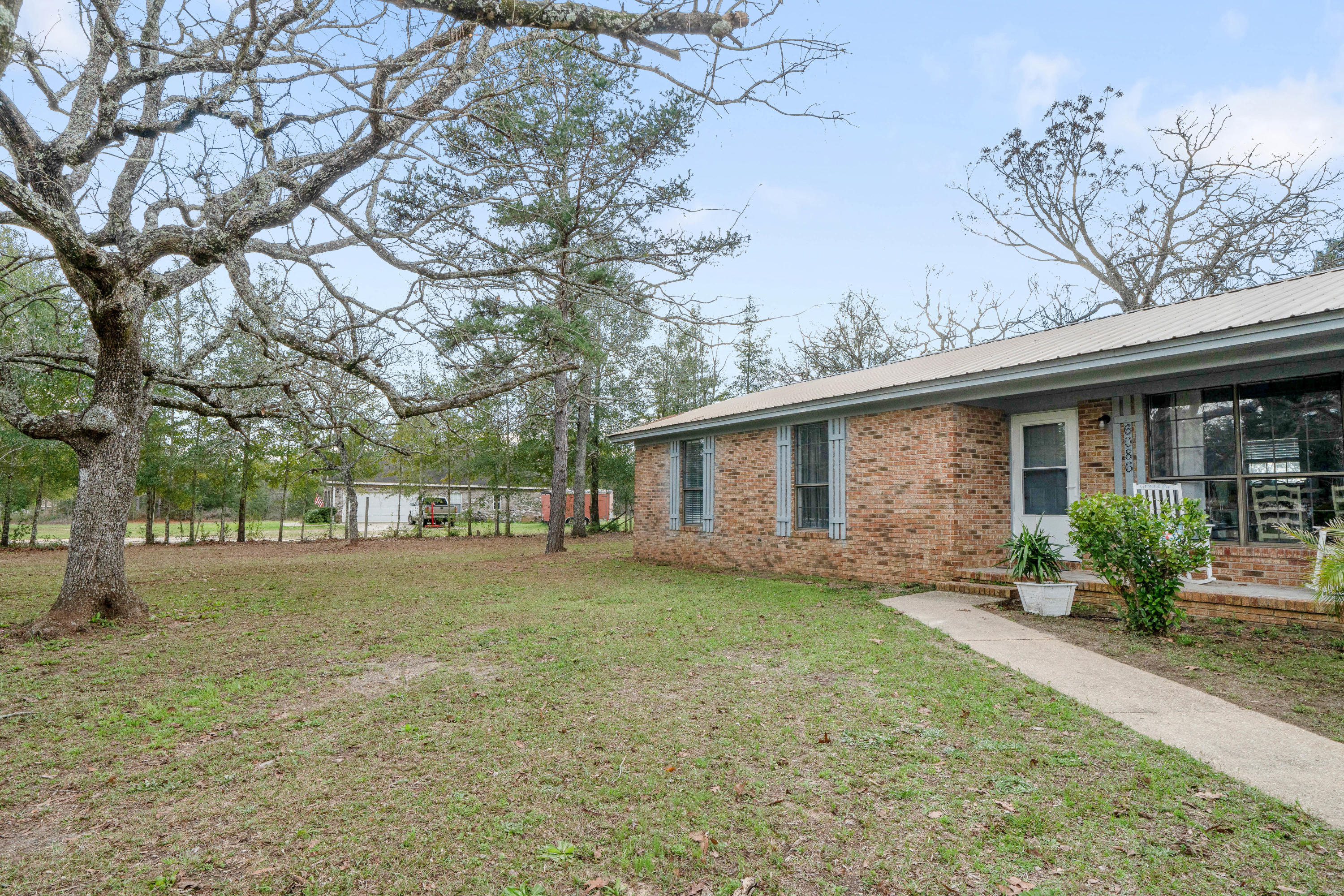 6086 Robin Road Crestview, FL 32539 - Photo 3 of 30 a view of a house with a yard