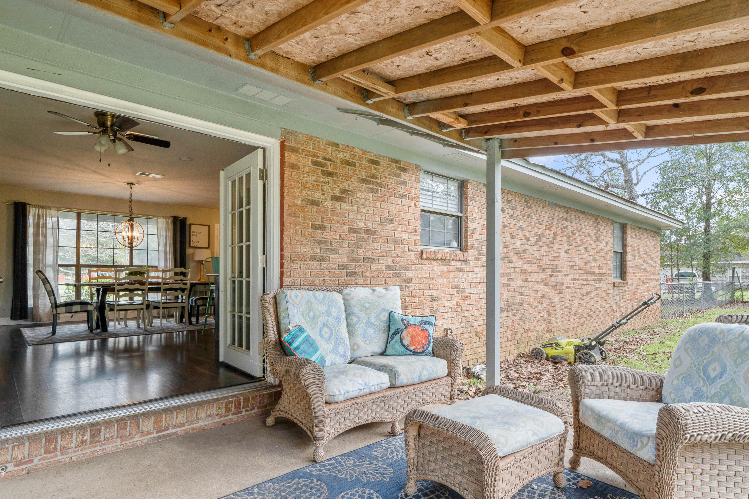 6086 Robin Road Crestview, FL 32539 - Photo 24 of 30 a living room with furniture and a floor to ceiling window