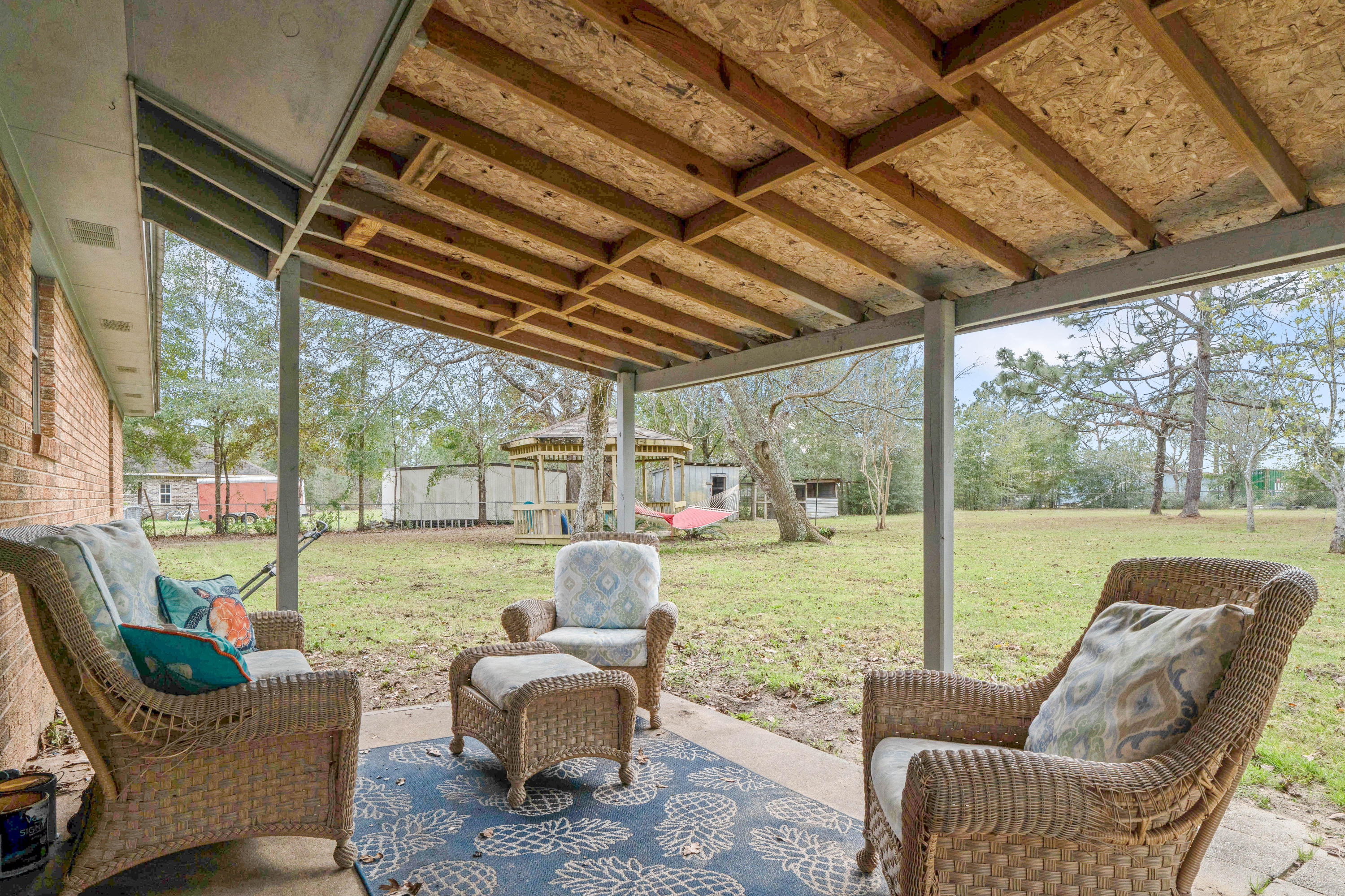 6086 Robin Road Crestview, FL 32539 - Photo 26 of 30 a outdoor living space with furniture and garden view