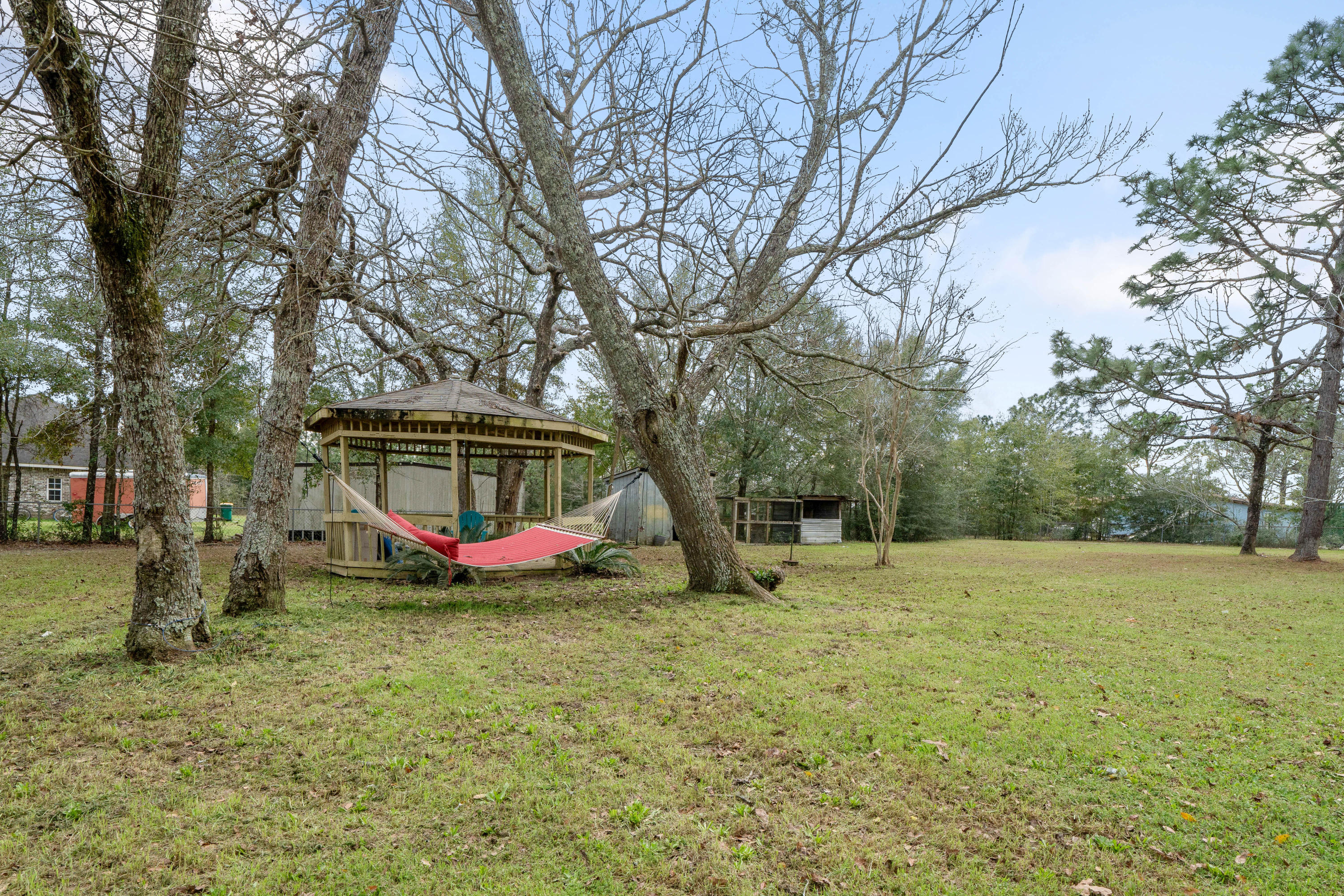 6086 Robin Road Crestview, FL 32539 - Photo 27 of 30 a view of outdoor space with garden and trees