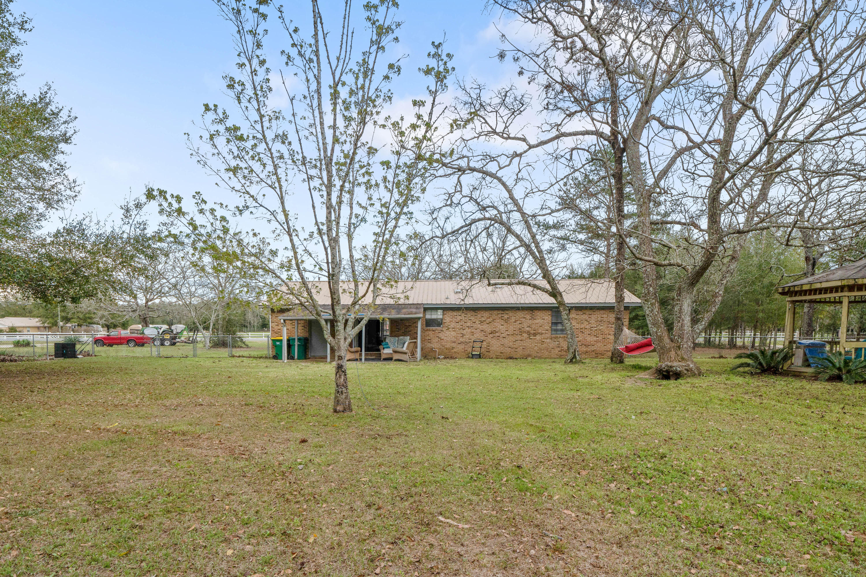 6086 Robin Road Crestview, FL 32539 - Photo 30 of 30 a view of a yard with a house in the background