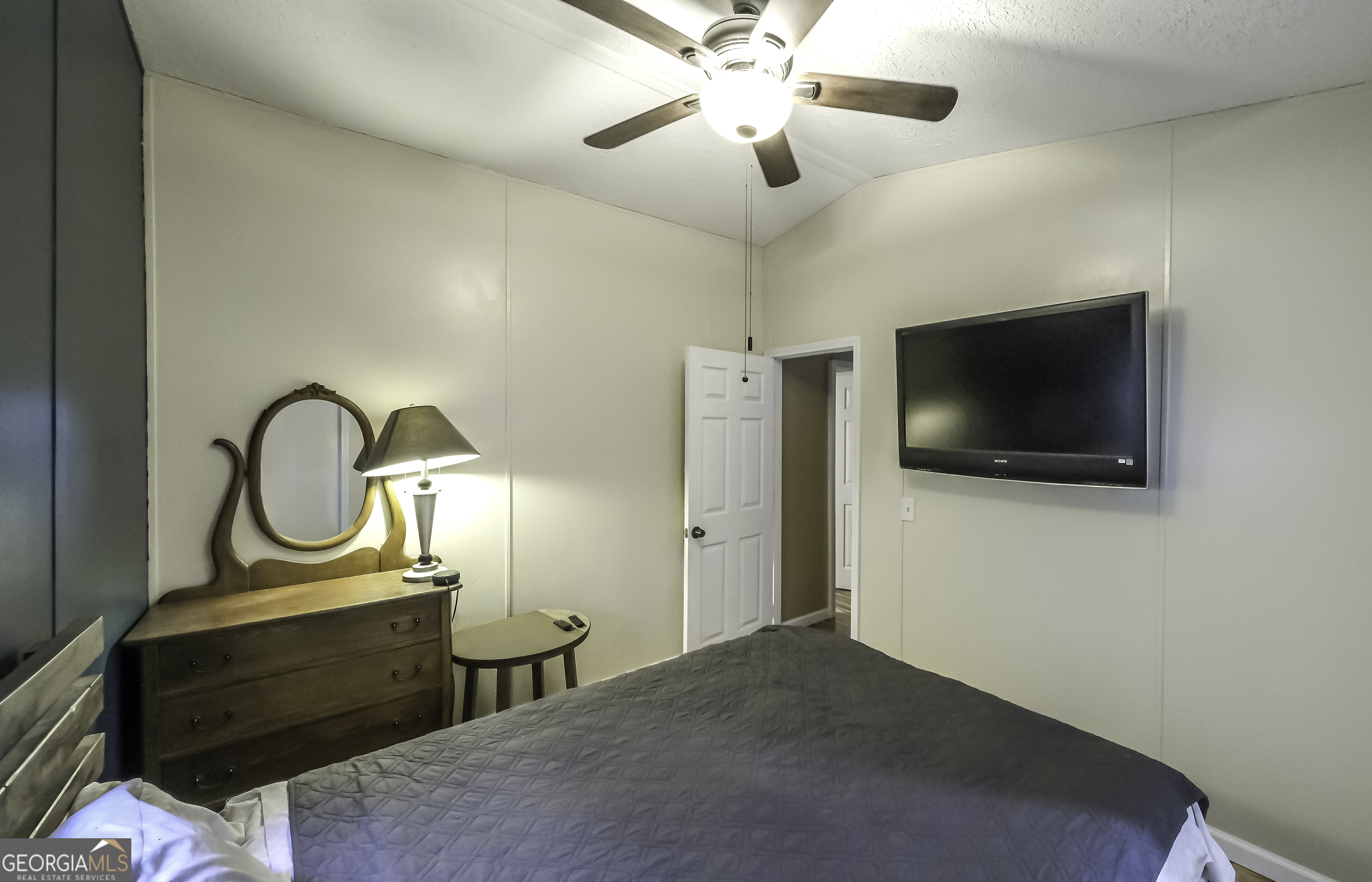 91 Holder Road Temple, GA 30179 - Photo 33 of 40 a view of a livingroom with furniture and a flat screen tv