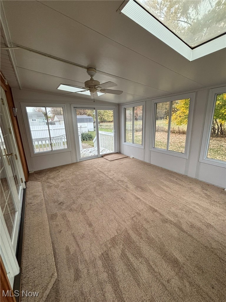 1039 Center Road Eastlake, OH 44095 - Photo 8 of 29 Sun room featuring skylights and sliding glass door leading out onto the deck