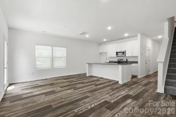 a view of kitchen with wooden floor