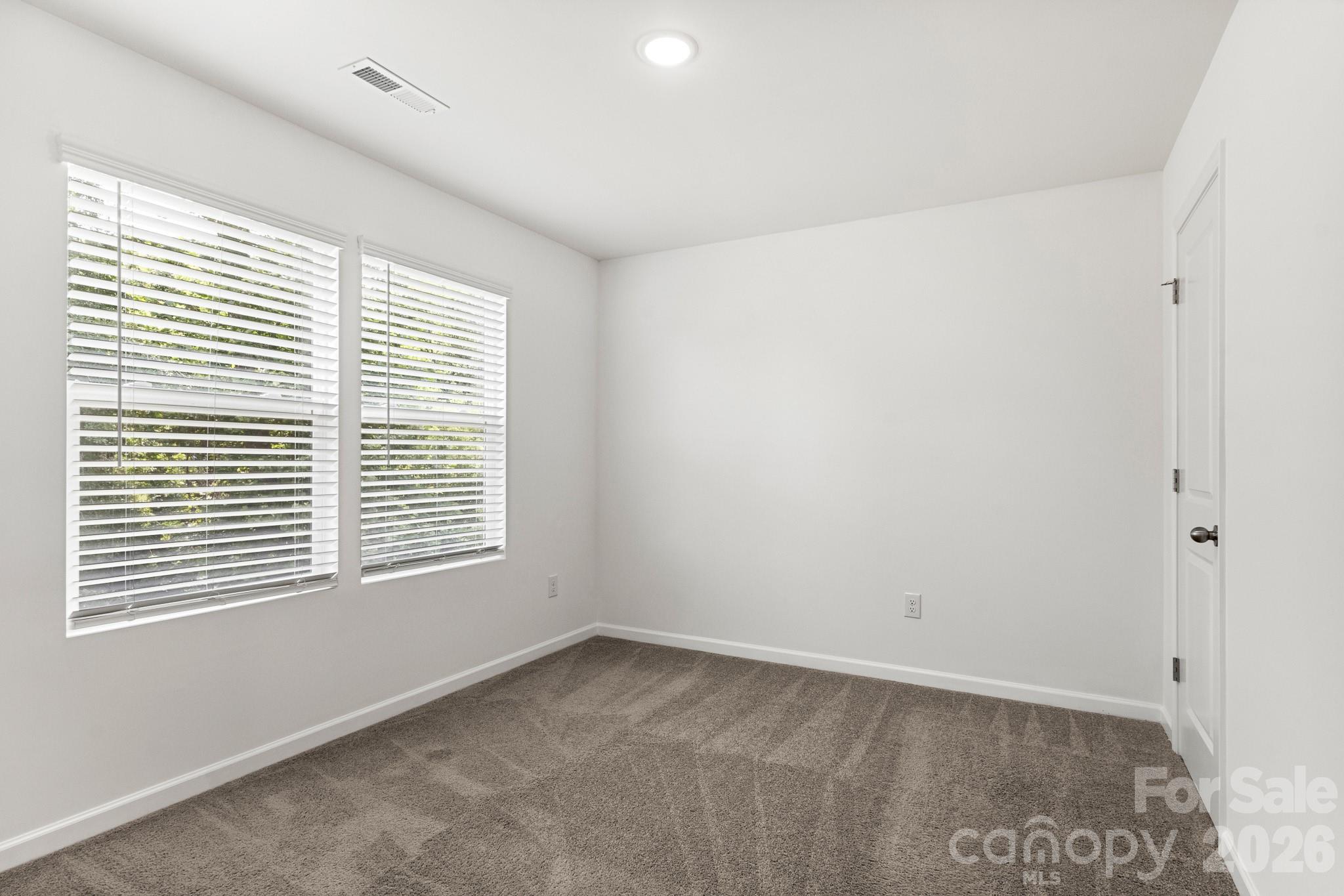 112 Angle Street Cherryville, NC 28021 - Photo 24 of 46 a view of an empty room with a window