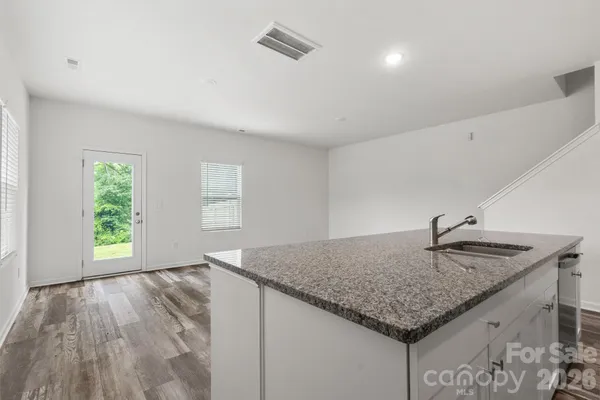 a kitchen with sink and window