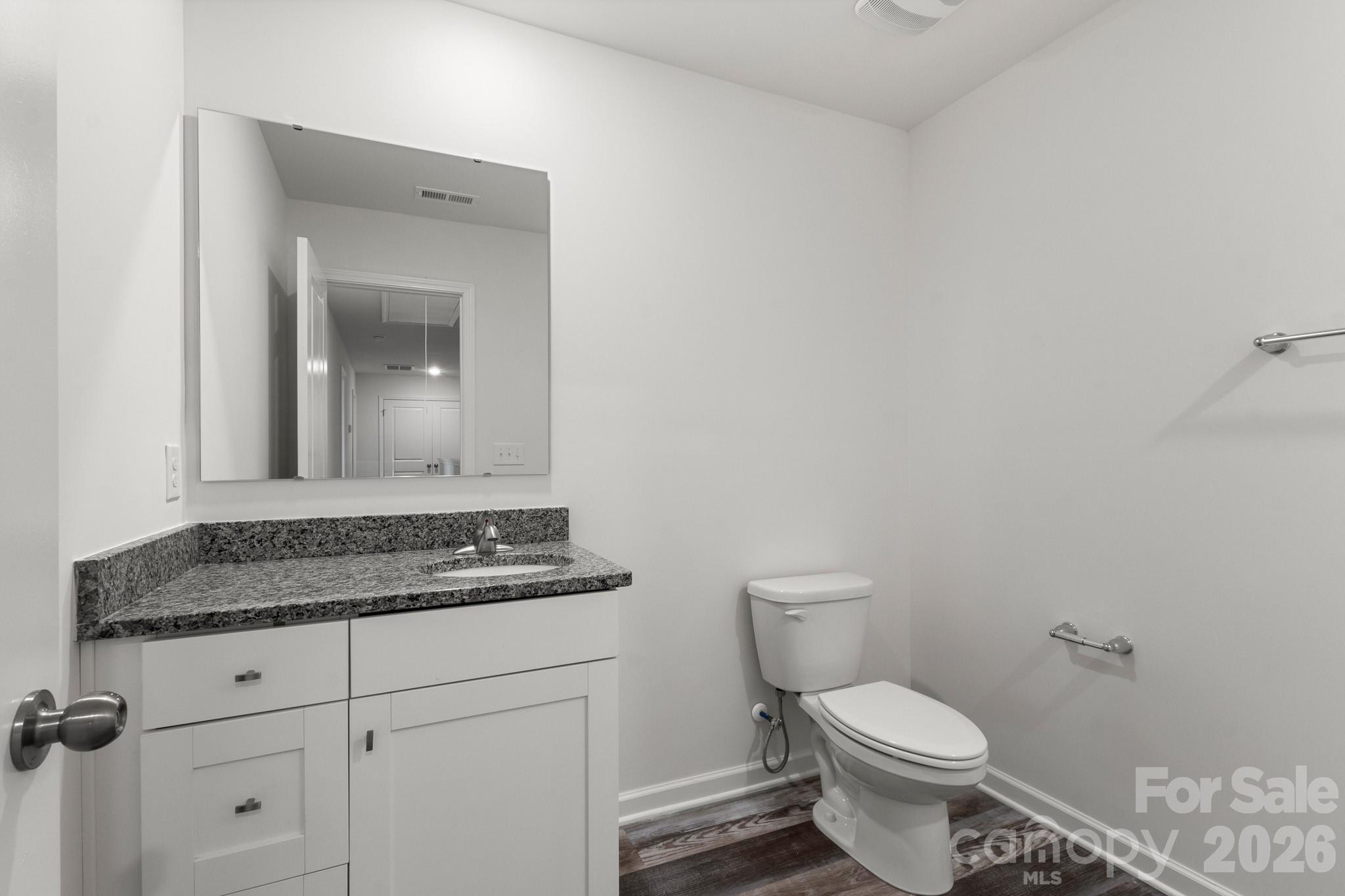 112 Angle Street Cherryville, NC 28021 - Photo 44 of 46 a bathroom with a granite countertop toilet and sink