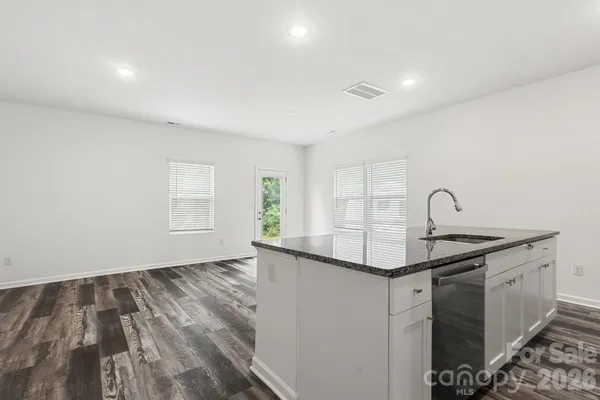 a view of a kitchen with a sink and dishwasher