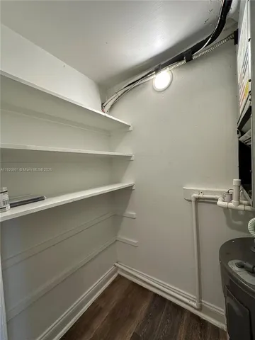 a view of storage and utility room with racks on the wall