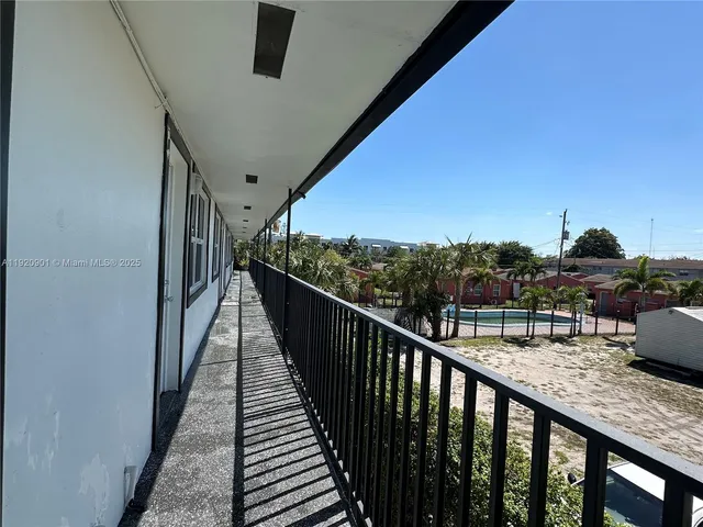 a view of balcony with furniture
