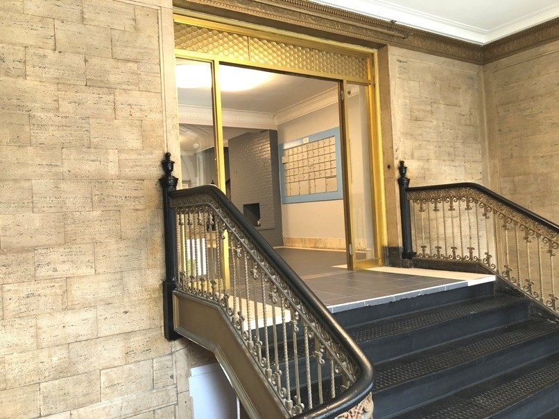 475 Commonwealth Avenue, Unit G3 Boston, MA 02215 - Photo 17 of 20 a view of staircase with railing and a chandelier