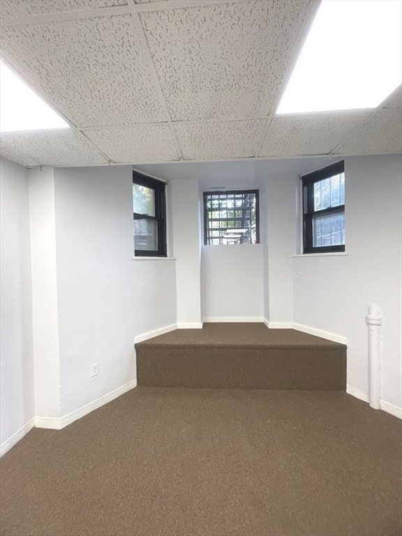 475 Commonwealth Avenue, Unit G3 Boston, MA 02215 - Photo 7 of 20 a kitchen with a bed and a window