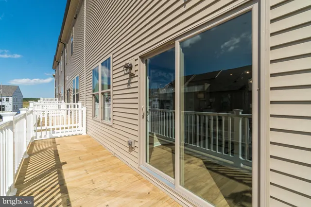 a view of a balcony with a floor to ceiling window