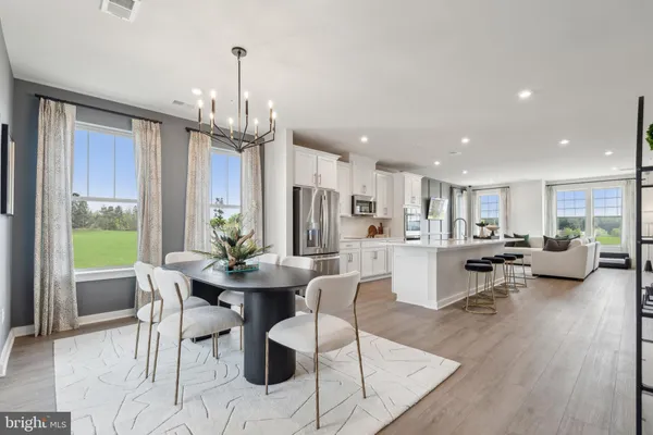 a view of house with swimming pool and yard