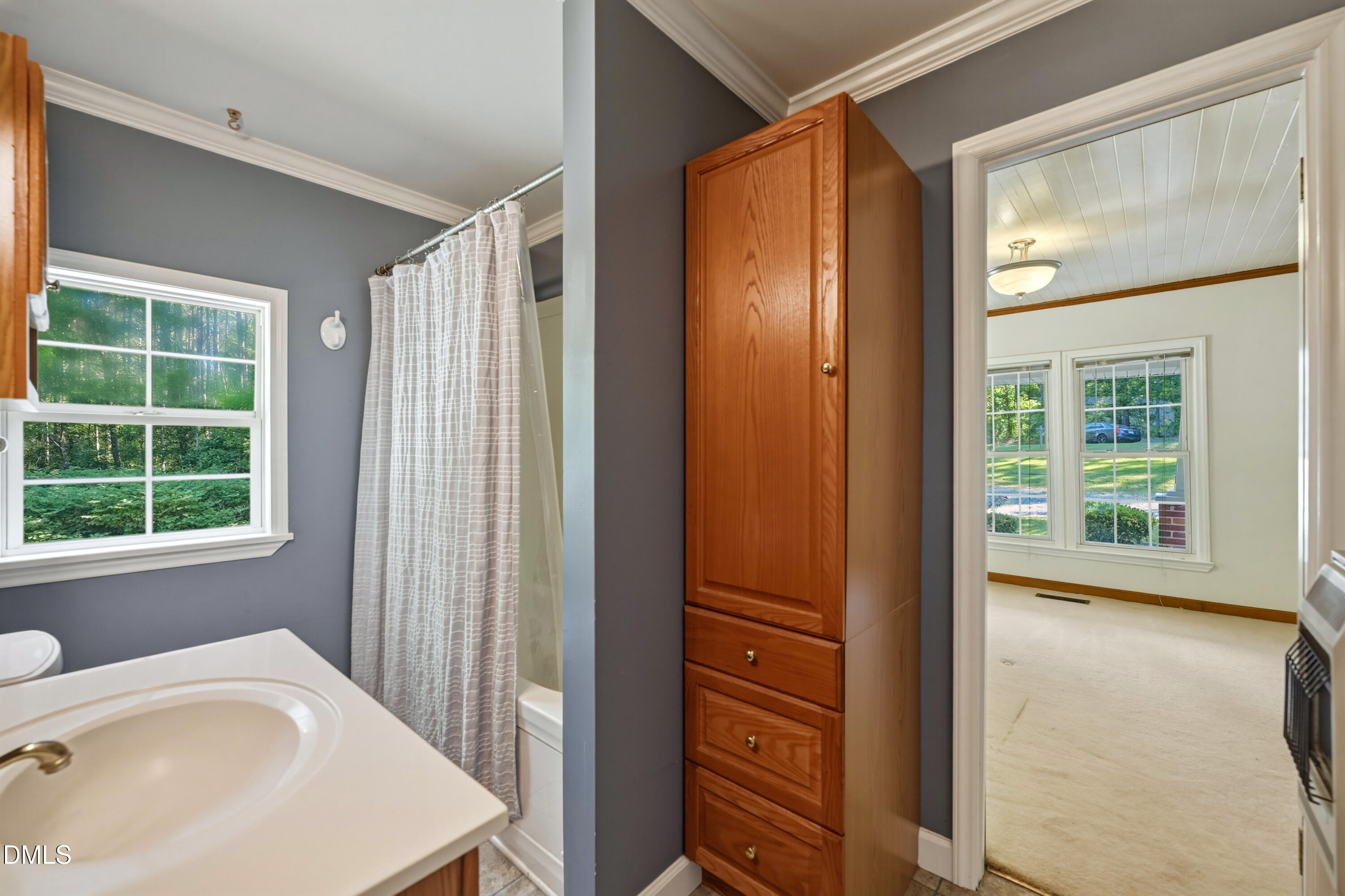 50 Robert Sledge Road Spring Hope, NC 27882 - Photo 16 of 50 a bathroom with a sink a mirror and a shower