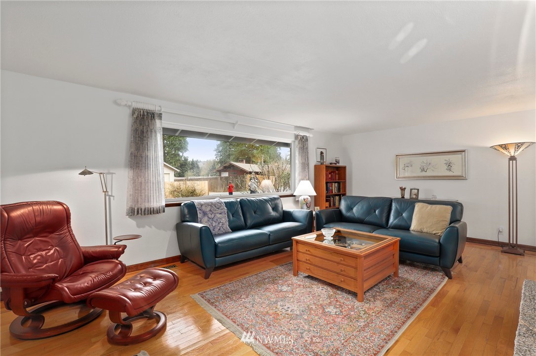 9302 Northeast 180th Street Bothell, WA 98011 - Photo 4 of 40 a living room with furniture a couch and a large window