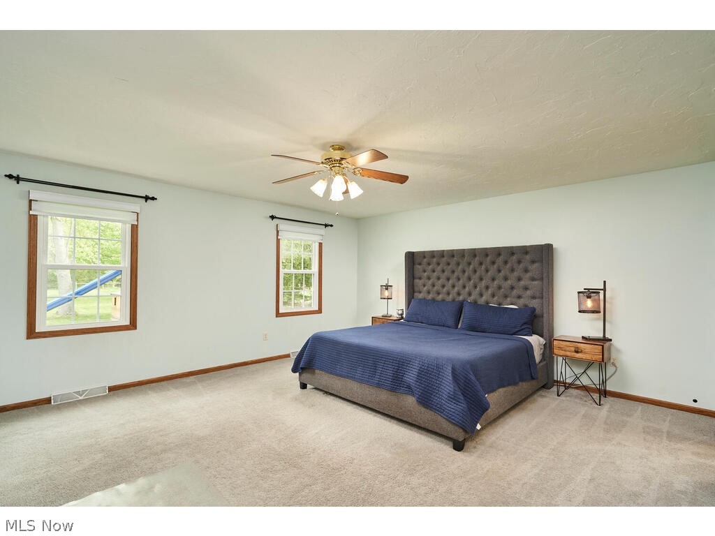 41780 Parsons Road Lagrange, OH 44050 - Photo 10 of 21 Bedroom featuring carpet, ceiling fan, and multiple windows