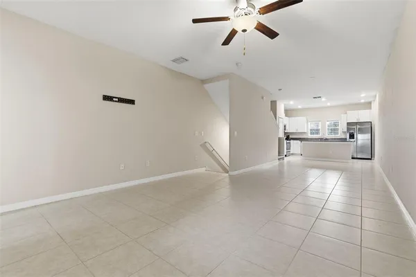a view of a kitchen with a sink and a window