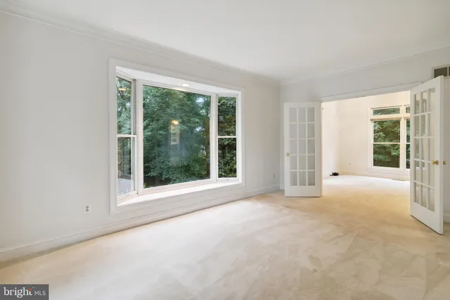 an empty room with windows and view