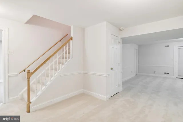 a view of an entryway with white walls