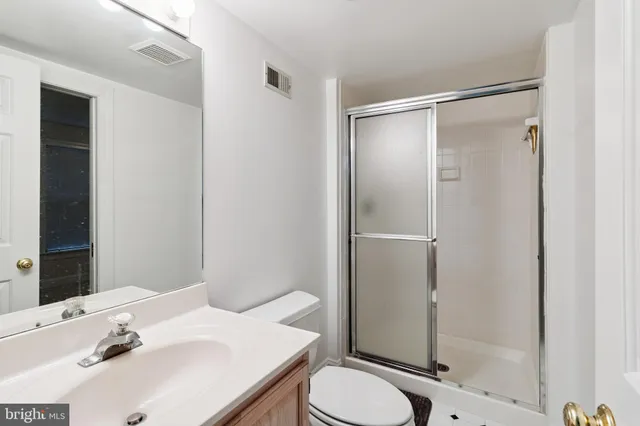 a view of a livingroom with a wooden floor and window