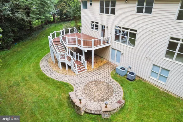 a view of a house with wooden floor and fence