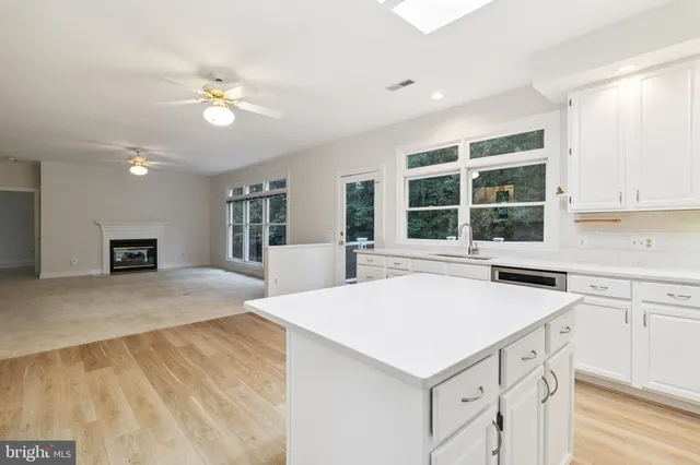 a kitchen with a stove a sink and a refrigerator