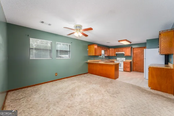 a kitchen with stainless steel appliances granite countertop a sink and dishwasher