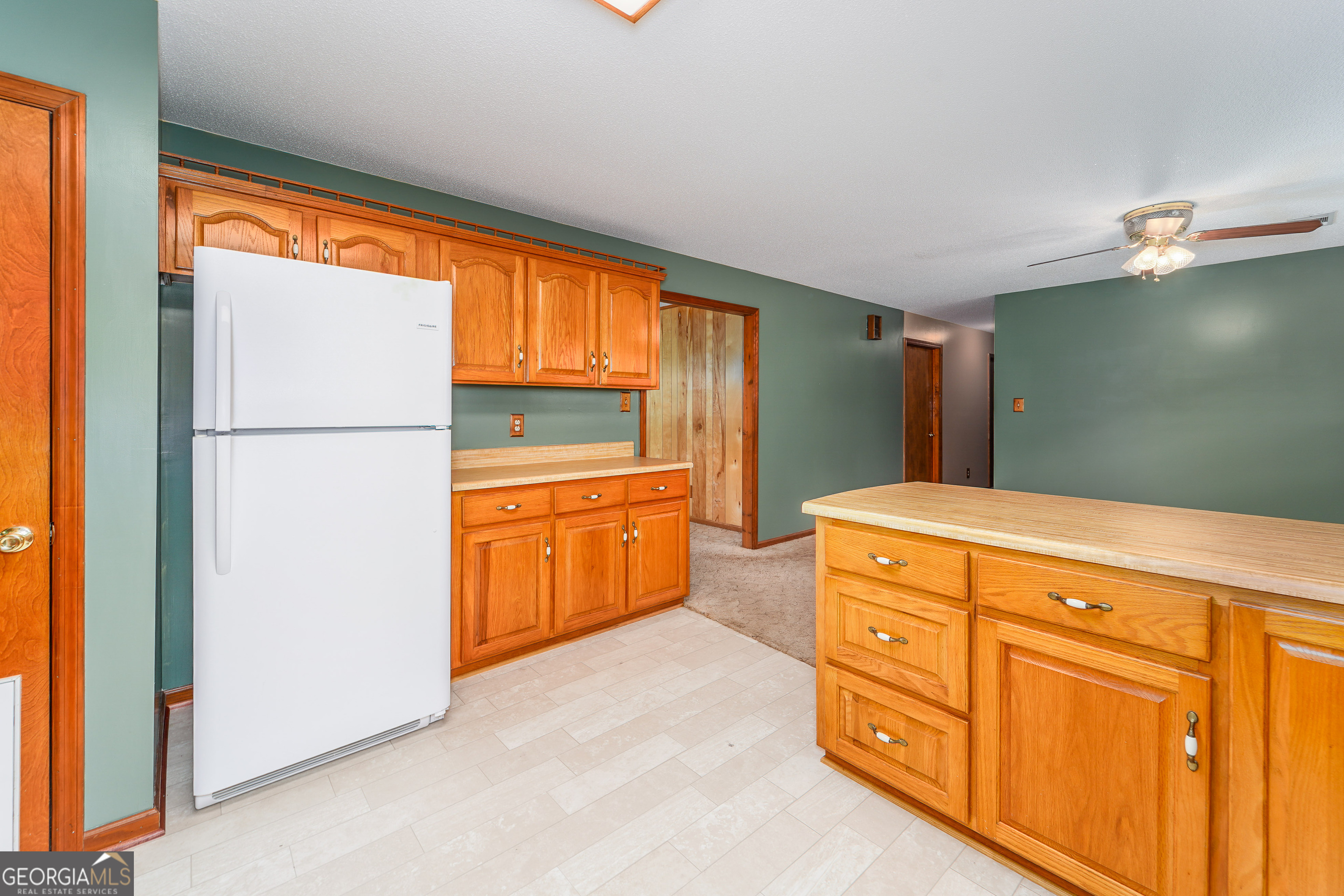 603 Cumberland Road Hortense, GA 31543 - Photo 15 of 26 a kitchen with sink a refrigerator and white cabinets