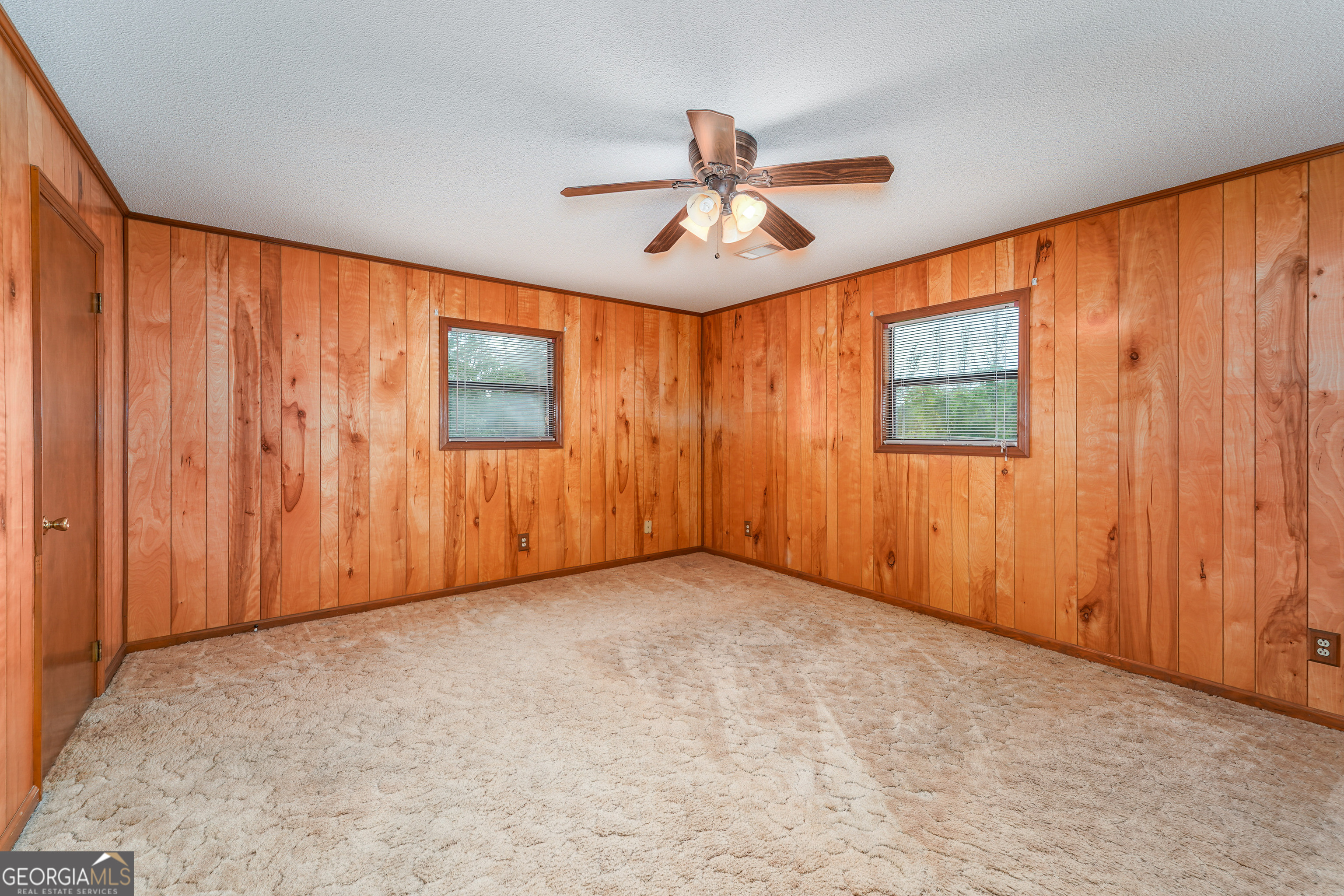 603 Cumberland Road Hortense, GA 31543 - Photo 17 of 26 an empty room with windows and fan