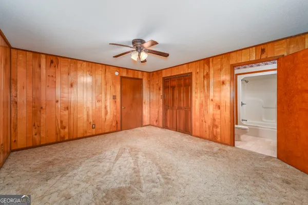 wooden floor in an empty room and a window