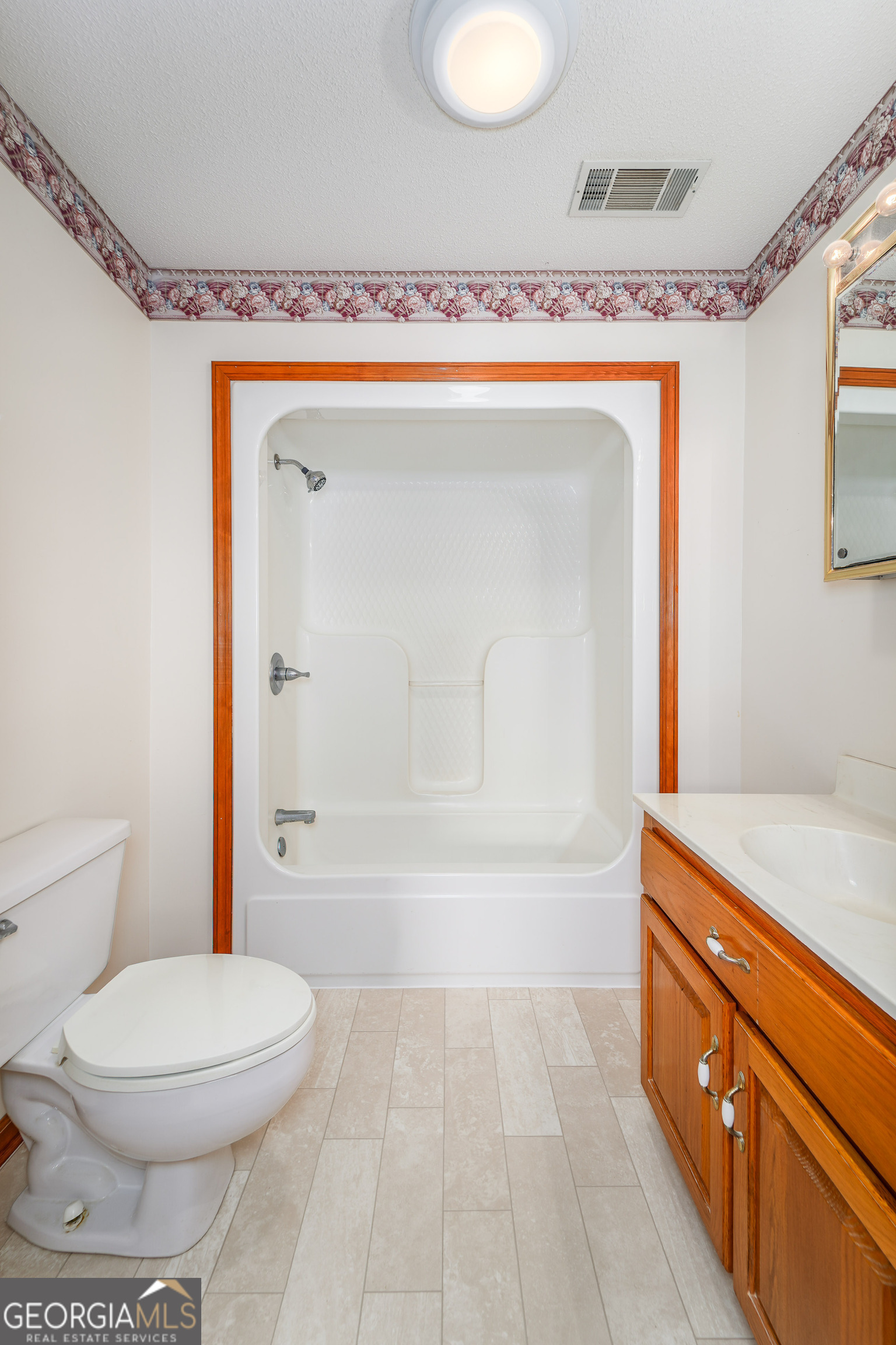 603 Cumberland Road Hortense, GA 31543 - Photo 19 of 26 a bathroom with a toilet a sink and shower