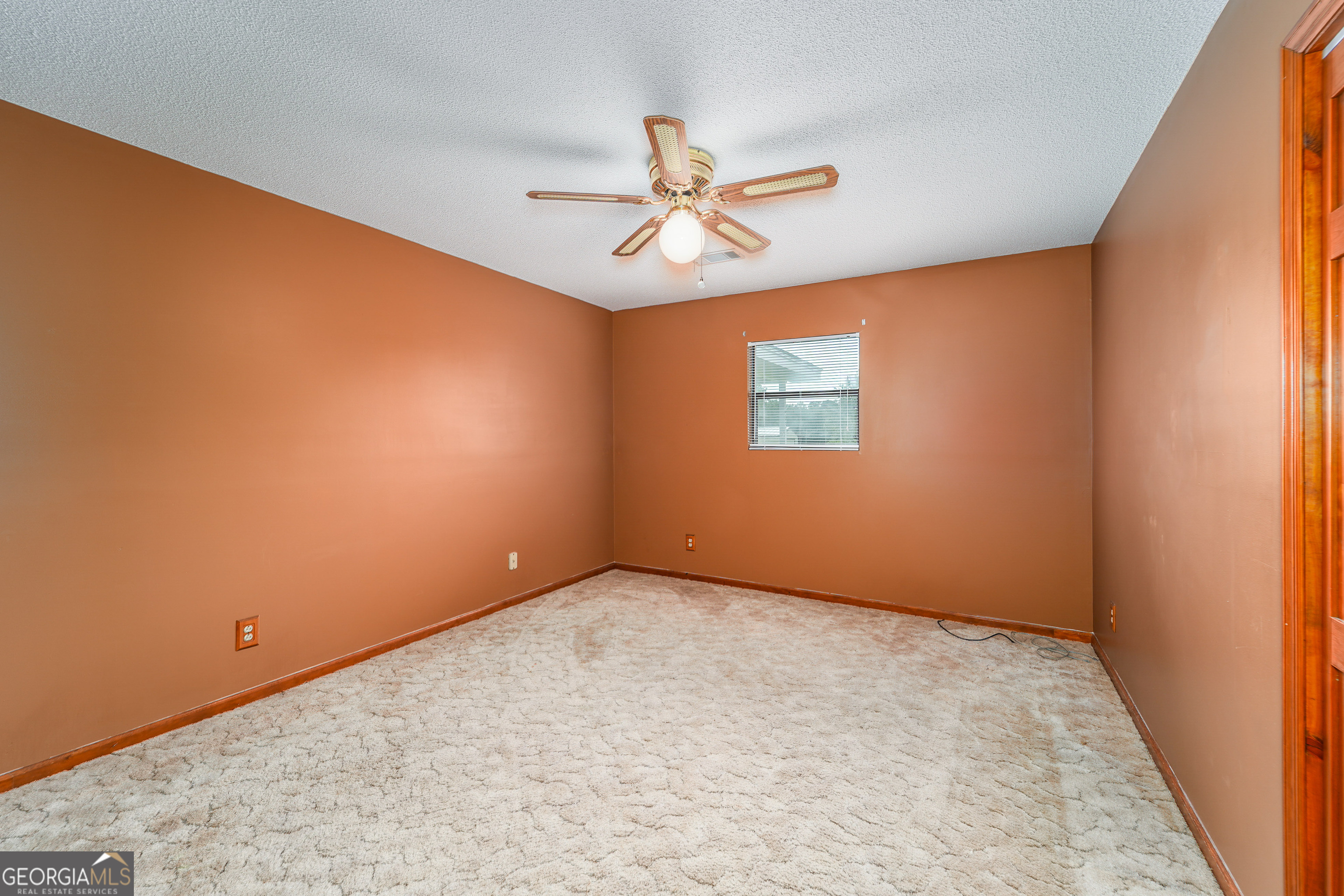 603 Cumberland Road Hortense, GA 31543 - Photo 20 of 26 an empty room with windows and fan