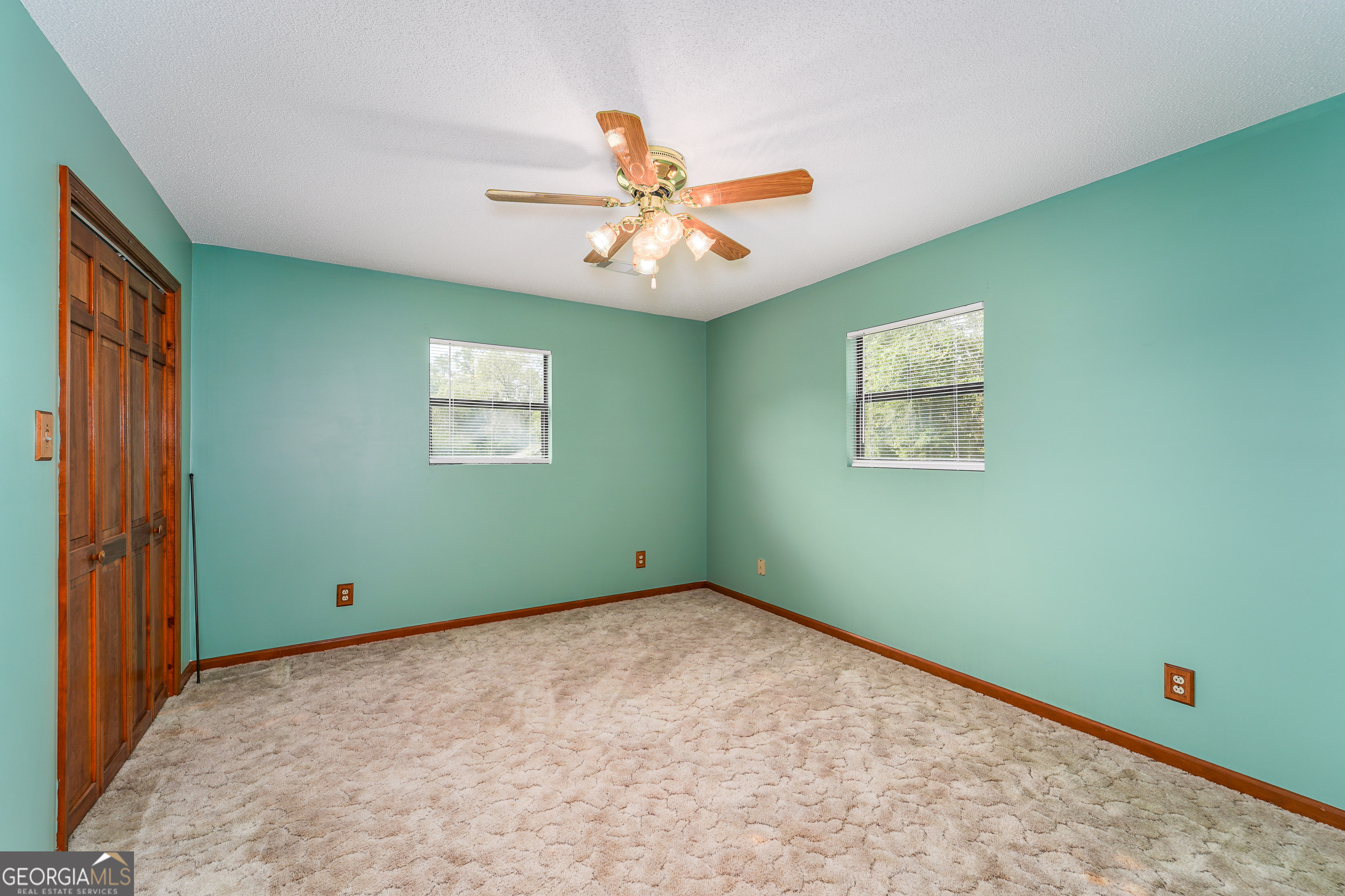 603 Cumberland Road Hortense, GA 31543 - Photo 21 of 26 a view interior room with window and ceiling fan