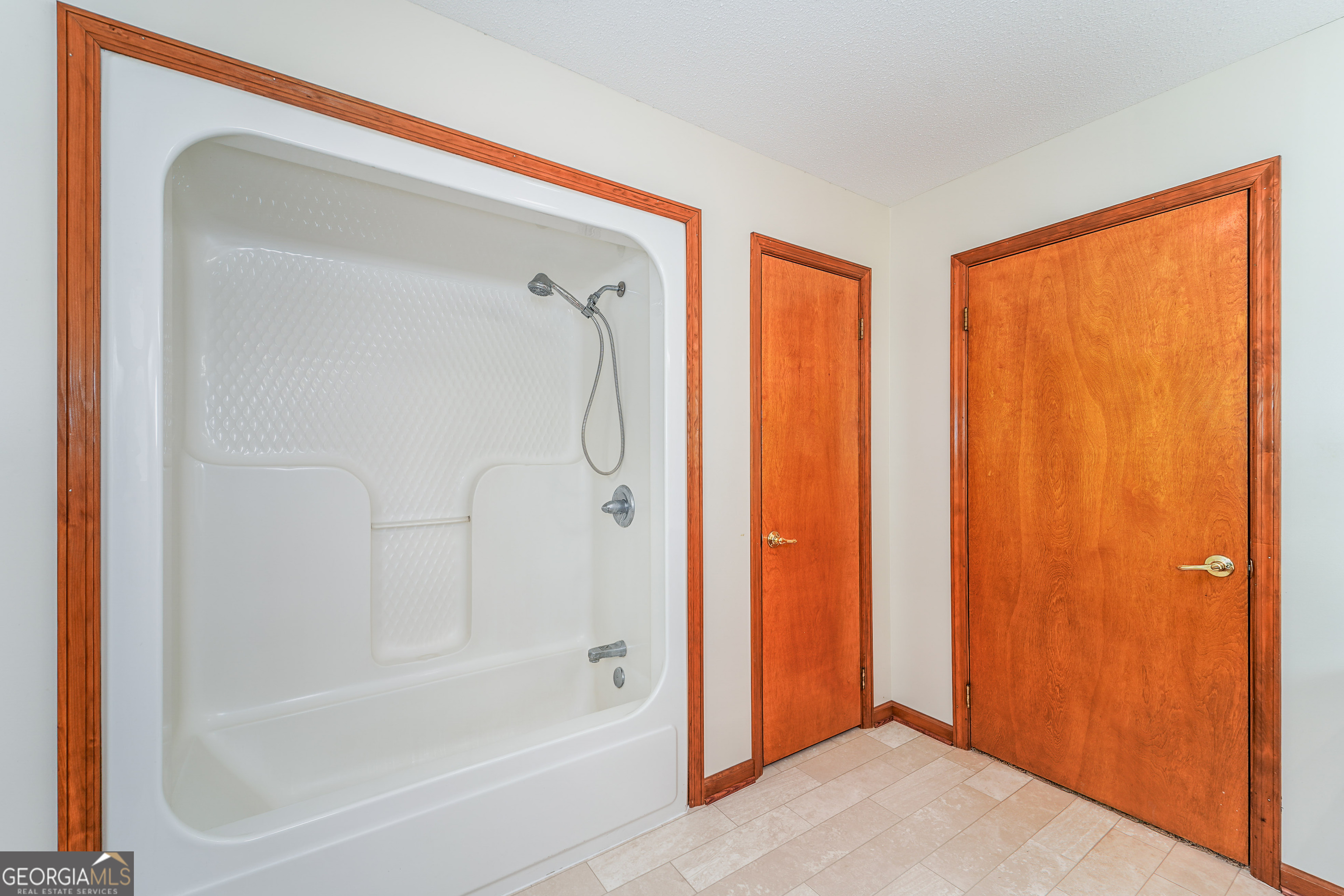 603 Cumberland Road Hortense, GA 31543 - Photo 24 of 26 a bathroom with a bathtub and a shower